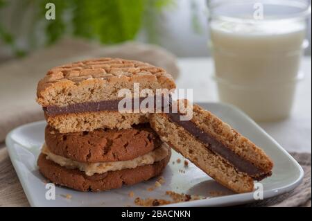 Chocolate and peanut butter filled peanut butter cookies and milk. Stock Photo
