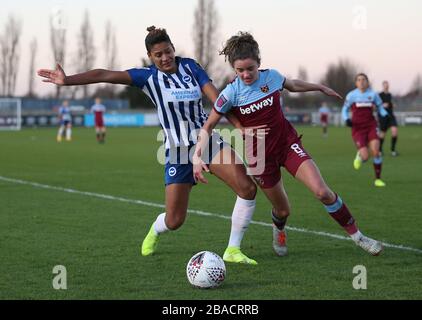 West Ham United's Leanne Kiernan (right) and Brighton and Hove Albion's Victoria Williams battle for the ball Stock Photo