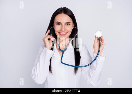 Photo of beautiful cheerful professional doc lady good mood friendly smiling patient using stethoscope to listen heart beat wear white lab coat Stock Photo