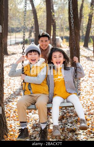Happy family playing outside Stock Photo
