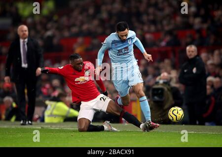 Manchester United's Aaron Wan-Bissaka tackles Burnley’s Dwight McNeil Stock Photo