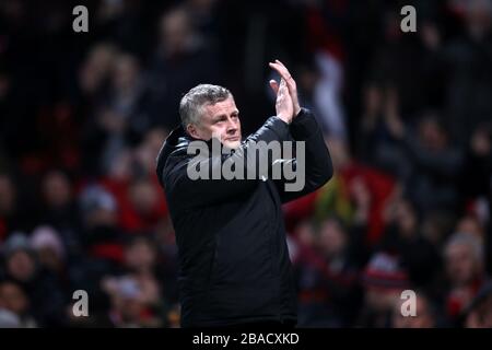 Manchester United manager Ole Gunnar Solskjaer applauds the fans before the match Stock Photo