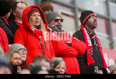 Manchester United fans show their support in the stands Stock Photo
