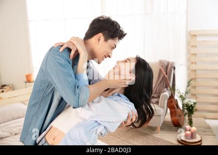 Happy young couple excited embrace Stock Photo