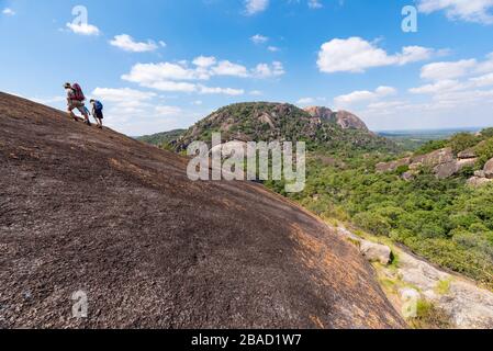 Tourists explore the unique landscape of the Matobo National Park in Zimbabwe. Stock Photo