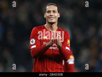 Liverpool's Virgil van Dijk celebrates victory and the Premier League