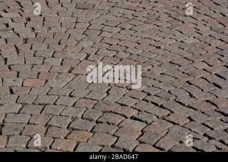 historical cobblestone pavement, old paving stone background Stock Photo