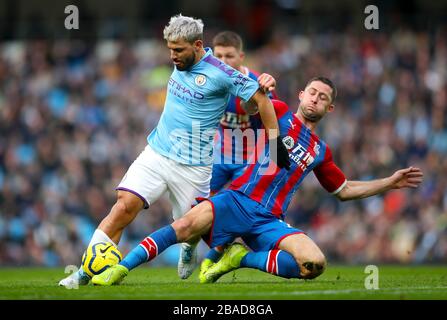 Manchester City's Sergio Aguero (left) and Crystal Palace's Gary Cahill battle for the ball Stock Photo