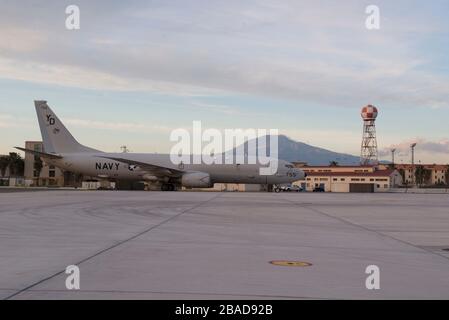 200226-N-CR843-0009 SIGONELLA, Italy (Feb 26, 2020) A Patrol Squadron (VP) 4 P-8A Poseidon aircraft is parked on the apron of Naval Air Station Sigonella with Mt. Etna in the background, Feb. 26, 2020. VP-4 is currently forward deployed to the U.S. 6th Fleet area of operations and is assigned to Commander, Task Force 67, responsible for tactical control of deployed maritime patrol and reconnaissance squadrons throughout Europe and Africa. (U.S. Navy photo by Mass Communication Specialist 2nd Class Juan Sua) Stock Photo