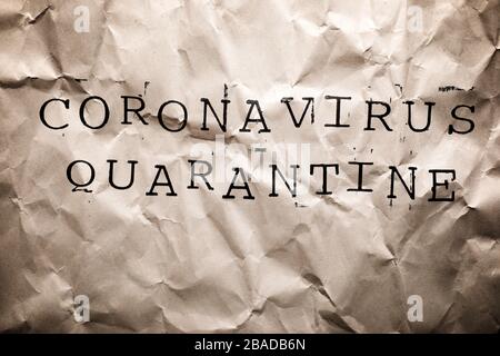 Coronavirus Quarantine text on a brown paper. Stock Photo