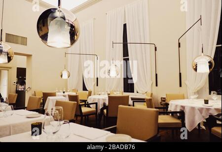 Milan, Italy circa January, 2020: Modern interior of a luxury restaurant in Milan, Lombardy region in Northern Italy Stock Photo