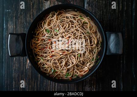 Homemade Organic Healthy Wheat Pasta Spaghetti Soba Noodle with Vegetables in Pan Ready to Serve. Traditional Food. Stock Photo