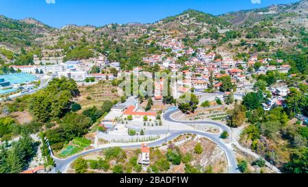 Aerial view of Agros village settlement on mountain Troodos, Limassol district, Cyprus. Bird's eye view of traditional houses with ceramic tile roof, Stock Photo