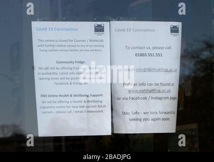 Paignton, Devon, England: Signs around the town warning of the Coronavirus danger, to keep a safe social distance and rainbows in support of the NHS Stock Photo