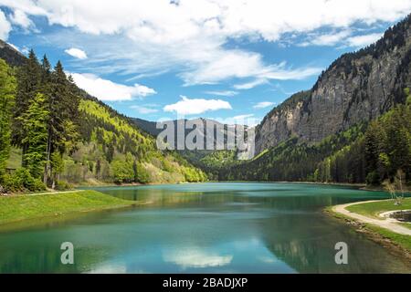 Le Lac de Montriond near Montriond in the Haute Savoie Region of France. There is a circular walk round the lake and it offers beautiful scenery. Stock Photo