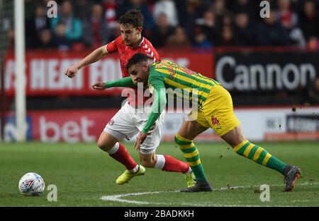 Charlton Athletic's Tom Lockyer (left) and West Bromwich Albion's Hal Robson-Kanu battle for the ball. This incident lead to both players being booked Stock Photo