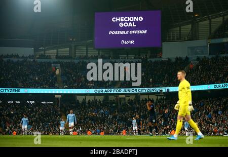 Video Assistant referee checks a goal for being offside Stock Photo