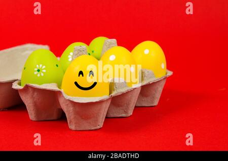 Colorful Easter eggs in a group on a red background Stock Photo