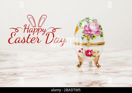 Luxury Easter egg with decorations on a marble background Stock Photo