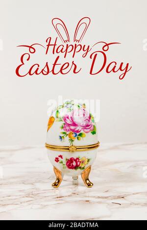 Luxury Easter egg with decorations on a marble background Stock Photo