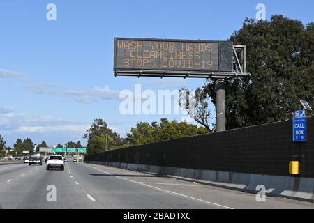 Caltrans message board on the Interstate 10 East freeway with the words 'Wash your hands. Cleanliness stops COVID-19' amid the global coroinavirus COVID-19 pandemic outbreak, Thursday, March 26, 2020, in Los Angeles.  (Photo by IOS/Espa-Images) Stock Photo