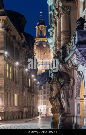 Dresden, Germany. 26th Mar, 2020. The Fürstenzug is deserted in the evening, with the Frauenkirche in the background. To contain the coronavirus, Saxony now bans all gatherings of three or more people in public. Credit: Robert Michael/dpa-Zentralbild/dpa/Alamy Live News Stock Photo