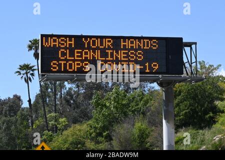 Caltrans message board on the Interstate 10 West freeway with the words 'Wash your hands. Cleanliness stops COVID-19' amid the global coroinavirus COVID-19 pandemic outbreak, Thursday, March 26, 2020, in Los Angeles. (Photo by IOS/Espa-Images) Stock Photo