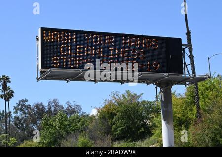 Caltrans message board on the Interstate 10 West freeway with the words 'Wash your hands. Cleanliness stops COVID-19' amid the global coroinavirus COVID-19 pandemic outbreak, Thursday, March 26, 2020, in Los Angeles. (Photo by IOS/Espa-Images) Stock Photo