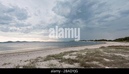 A storm forms over the southern end of Jimmys Beach at Winda Woppa near the coastal town of Hawks Nest in New South Wales, Australia Stock Photo