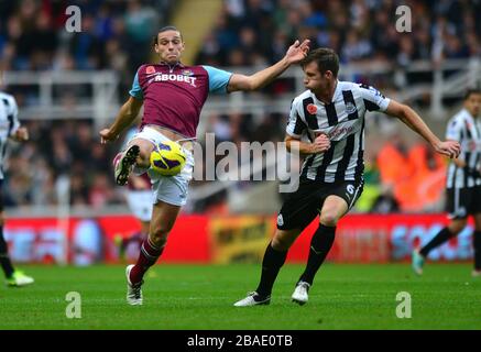 Newcastle United's Mike Williamson (right) and West Ham United's Andy Carroll (left) in action Stock Photo