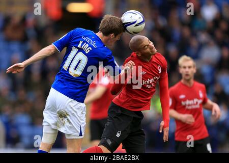 Nottingham Forest's Adlene Guedioura is beaten to a ball in the air by Leicester City's Andy King Stock Photo