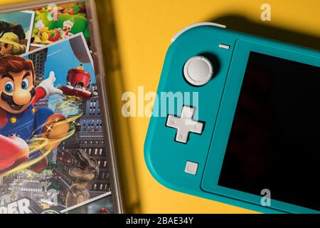 LONDON - MARCH 12, 2020: Nintendo Switch Lite handheld video game console Stock Photo