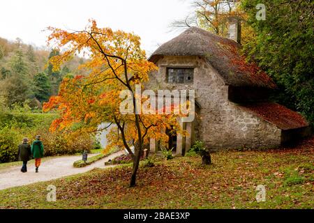 Autumn colour outside the Gothic Cottage at Stourhead Gardens, Wiltshire, England, UK Stock Photo