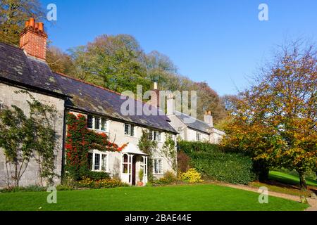 Autumn colour around the cottages at Stourhead Gardens, Wiltshire, England, UK Stock Photo