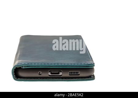Close up view of mobile phone in green case isolated on white background. Communication concept. Stock Photo