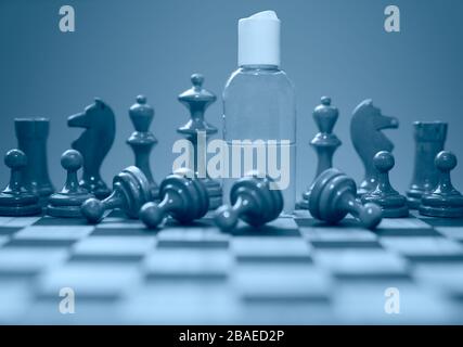 Coronavirus concept image chess pieces and hand sanitizer on chessboard illustrating global struggle against novel covid-19 outbreak. Stock Photo