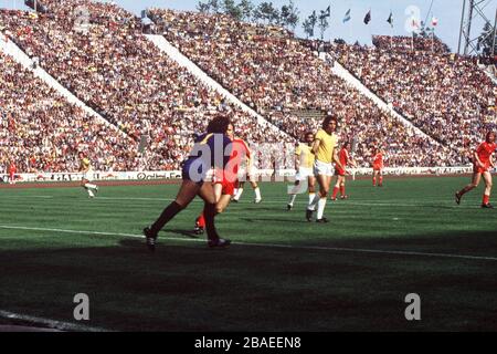 LEAO OF BRAZIL GATHERS THE BALL WHILST GRZEGORZ LATO OF POLAND CLOSES IN Stock Photo