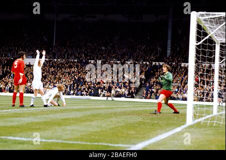 Liverpool's Ray Clemence (right) and Larry Lloyd (left) look stunned as Leeds United's Billy Bremner (second left) and Mick Jones (second right) celebrate Jones's goal, scored with an overhead kick Stock Photo