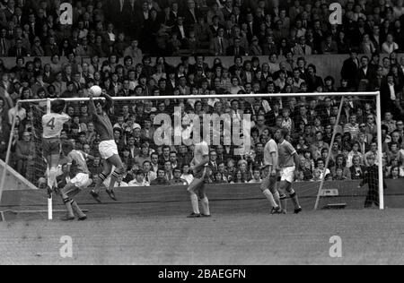 Manchester City goalkeeper Joe Corrigan (third l) rises to claim a cross Stock Photo