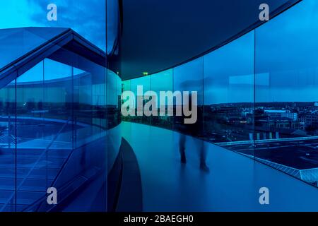 Your Rainbow Panorama by Olafur Elliasson sitting on top of the ARoS art gallery in Aarhus in Denmark. Glass walls fade through rainbow colours. Stock Photo