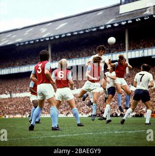 Tottenham Hotspur's Mike England (fourth l) beats West Ham United's (l-r) Frank Lampard, Bobby Moore, Tommy Taylor and Billy Bonds to a header Stock Photo