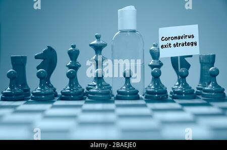 Coronavirus concept image chess pieces and hand sanitizer on chessboard illustrating global struggle against novel covid-19 outbreak with coronavirus Stock Photo