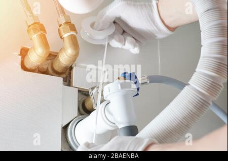 Fixing plumbing system in bathroom close up view Stock Photo