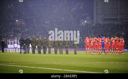 Both teams observe a minute's silence before the game Stock Photo