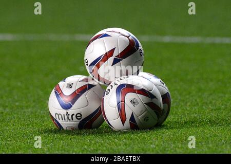 Detail of a pile of official Crawley Town Mitre footballs on the pitch before the game Stock Photo