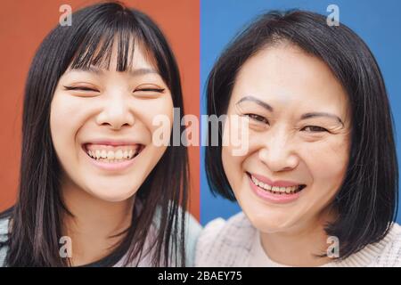 Happy Asian mother and daughter having fun outdoor - Portrait Chinese family people spending time together outside Stock Photo