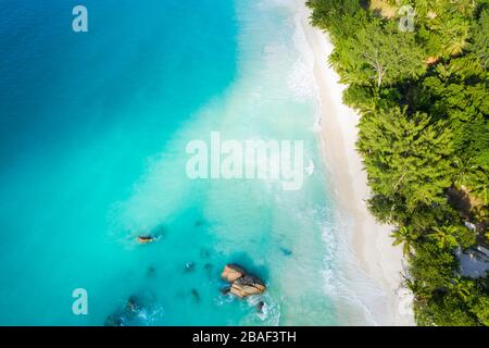 Stunning Anse Lazio beach drone aerial view in Praslin Island Seychelles Turquoise ocean water Stock Photo