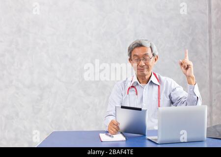 Chinese doctor using computer tablet with figured out thinking find a solution to anti virus found something and creativity action. Stock Photo