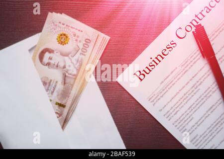 graft bribe money pay when call for bids for business contract Stock Photo
