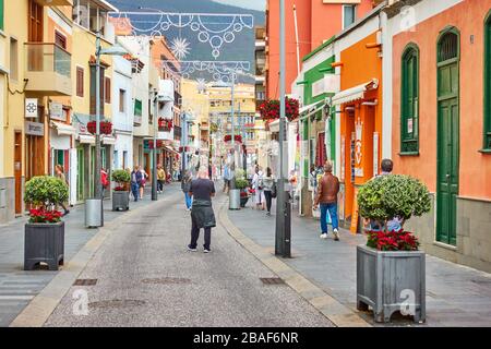 Candelaria, Tenerife, Spain - December 12, 2019: Street in Candelaria town with walking people Stock Photo
